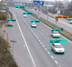 Vehicle detection and tracking trafic scene with bounding boxes around each vehicle